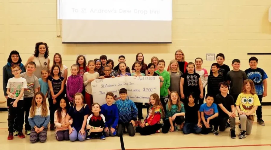 Holy Cross Helps Out Dew Drop Inn