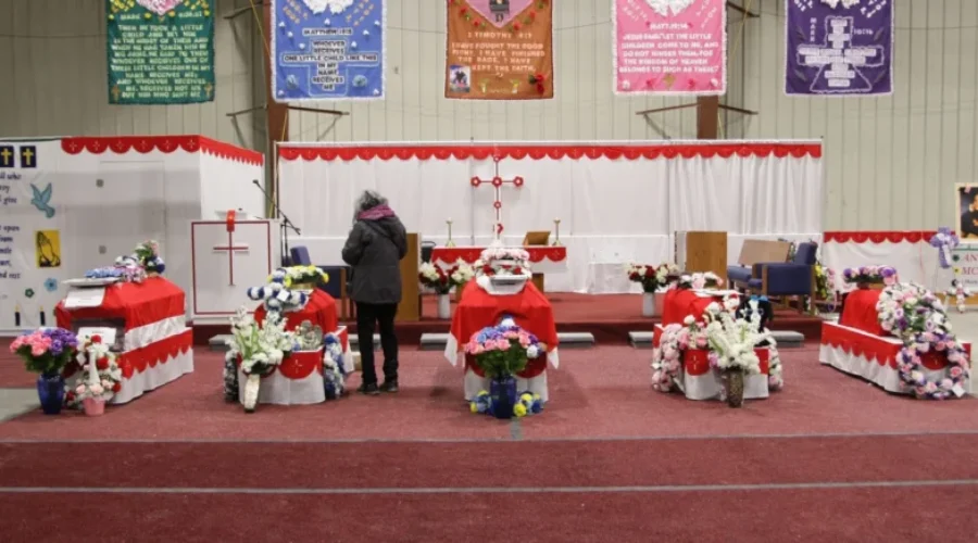 Community Bears Grief At Funeral