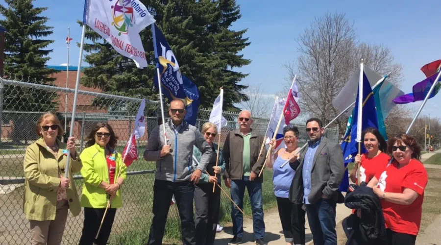 Minister Greeted With Protest & Critique