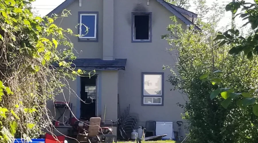 Woman Escapes House Fire