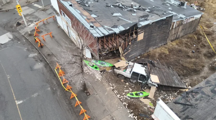 Man facing charges after crashing truck into a building on Simpson Street