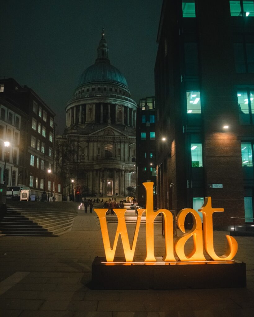yellow love freestanding letters on street during nighttime