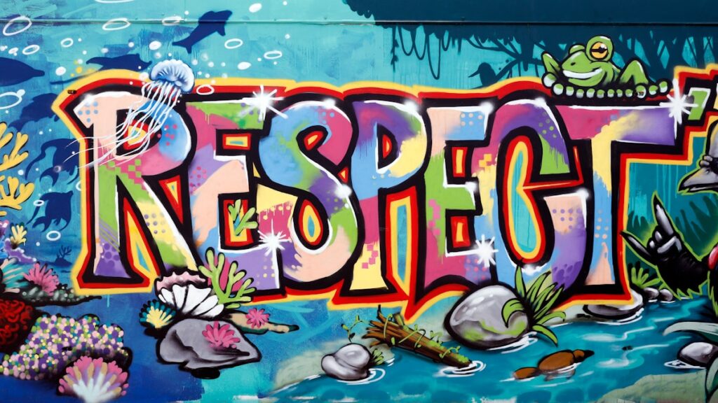 a colorful wall with the word respect painted on it