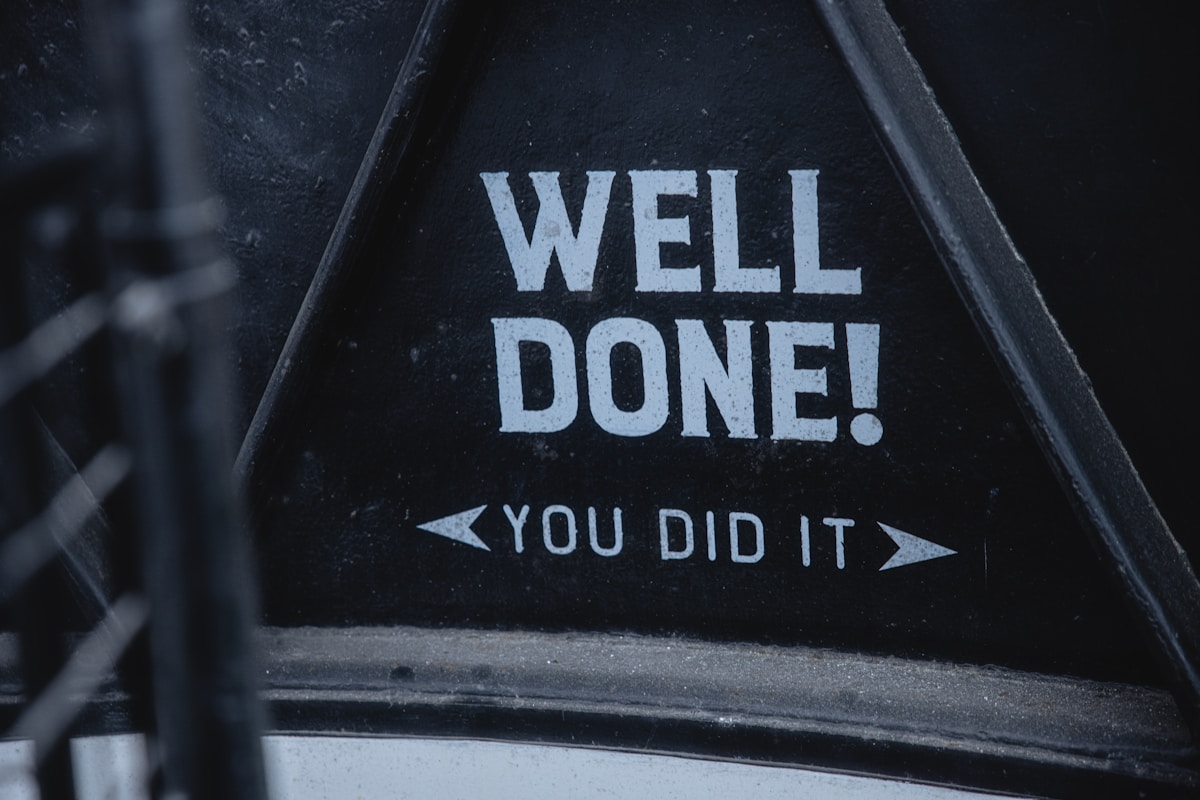 a sign that says well done you did it