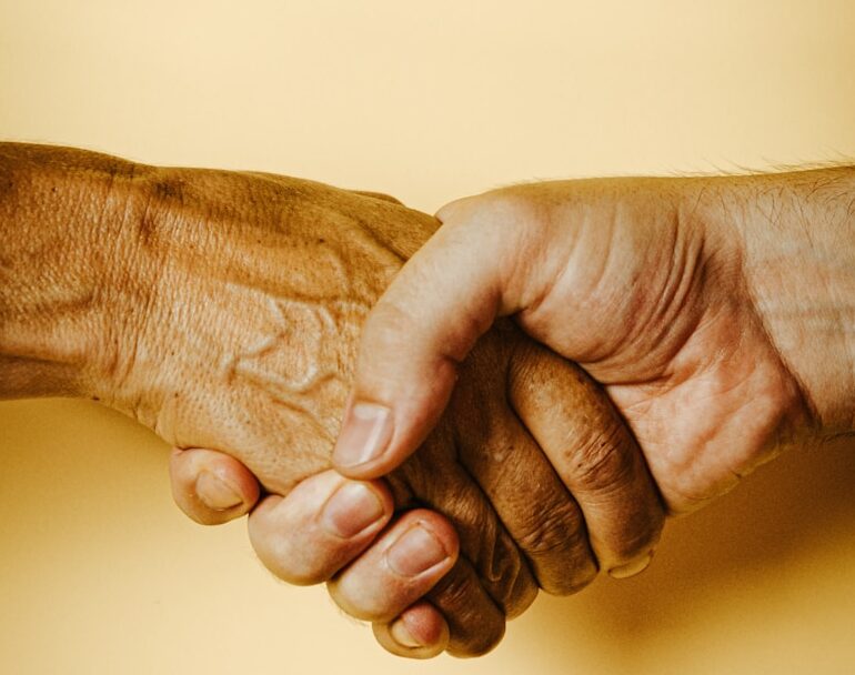 person holding babys hand