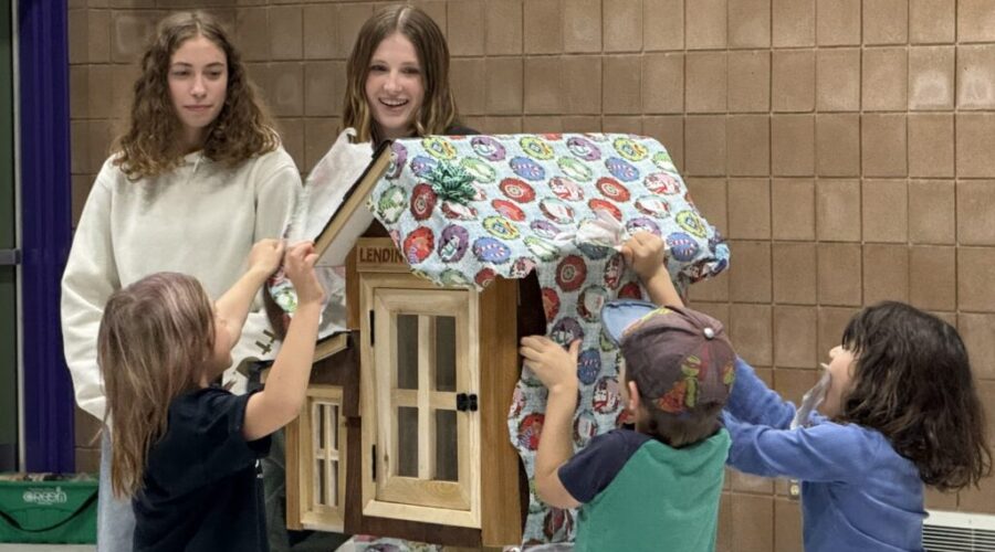 Grade 1 students at Claude E. Garton receive lending library