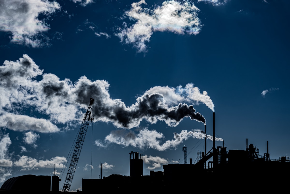 a factory with smoke coming out of it's stacks