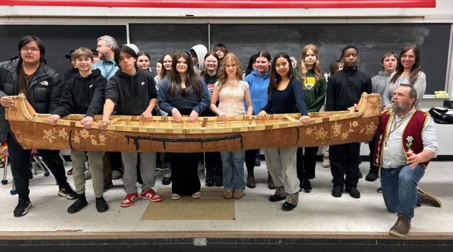 Middle schoolers gift handcrafted canoe to Hammarskjold High